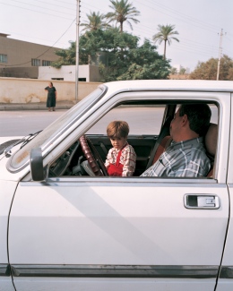 Baghdad, kid in parking car, 6 months prior to 2nd Iraq War